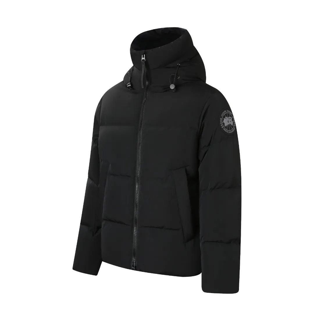 P980 Canada Goose hooded down jacket Fabric selection: Weaved with 400T high-count yarn. After special water-repellent treatment, the surface forms a lotus leaf effect - raindrops will slide down in beads, and snow particles will fall off when touched. The tear resistance reaches 200N (approximately 20kg load-bearing), the light gray matte texture breaks the stereotype of "outdoor clothing = hardcore", and the soft luster presents a high-end matte effect under urban neon lights, seamlessly switching scenes from ski resorts to CBD office buildings.  Process 1: Use polyester woven ribbons as the base, and use high-precision computer embroidery to decorate the brand letters on the ribbons. The edges of the pattern are clear, the stitches are fine and even, and multiple layers of embroidery threads are stacked to enhance the three-dimensional effect.  Process 2: Precision thread reinforcement to prevent velvet drilling and ensure that the fluffy and resilient elasticity lasts as new.  Details: The embedded cuffs are three-dimensionally woven to form a "wavy" elastic structure, forming natural folds when fitting the wrist, increasing the contact area with the skin, thus improving the windproof effect. At the same time, micro-velvet treatment is added to the inside of the cuffs, which feels like a second layer of skin and avoids friction on the skin from metal zippers or hard fabrics.  90 national standard high-quality white duck down: selected high-loft down, weighing 240g, light and warm, with excellent temperature locking performance and good resilience.  Accessories: 1:1 customized armband, 1:1 customized zipper pendant, 1:1 customized elastic buckle, etc. SIZE: S M L XL